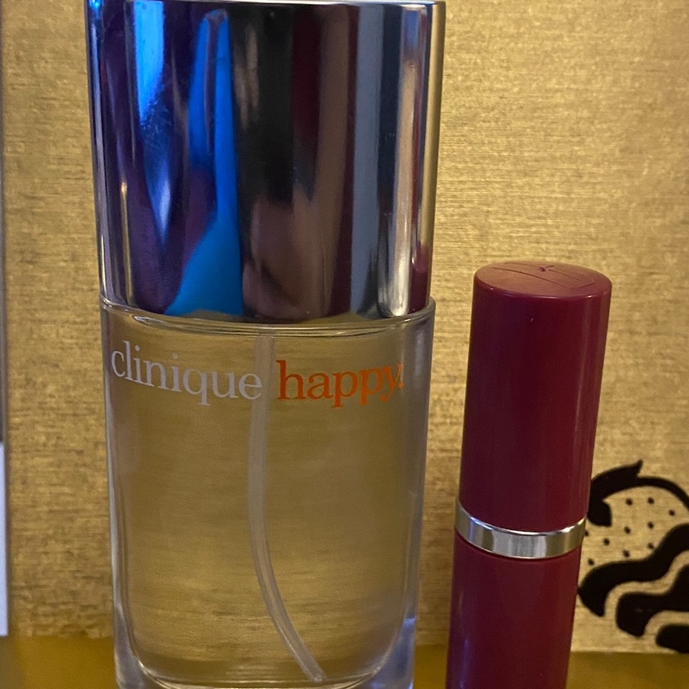 New Unused bottle of Clinique Happy perfume AND clinique lip primer